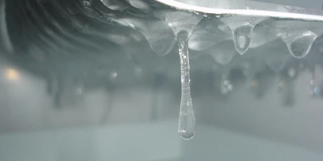 Close-up of frozen water drops in ice maker