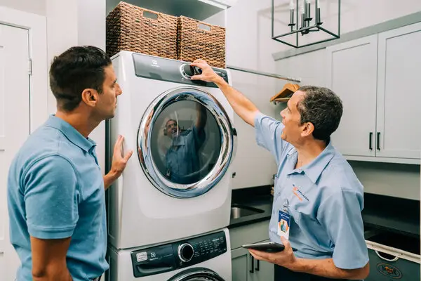 Mr. Appliance tech helping homeowner with dryer repair in Fort Myers